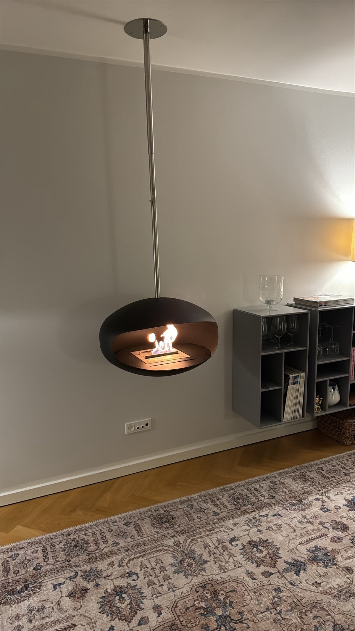 Cocoon Aeris Black Bioethanol Fireplace with Steel Mount shown in a room setting