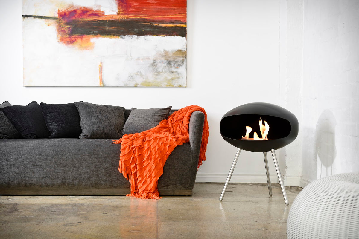Cocoon Terra Black Bioethanol Fireplace shown in a room setting