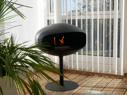 Cocoon Pedestal Black Bioethanol Fireplace shown in a room setting